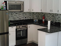 Kitchen cabinets, backsplash tiles, countertop, sink,